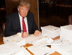Trump signing the tax return he refuses to release
