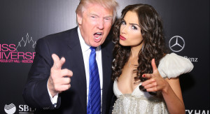 Trump comparing finger length with a beauty pageant contestant in Moscow in 2013.